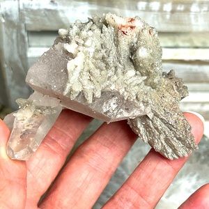 Hydroxyapophyllite on Quartz